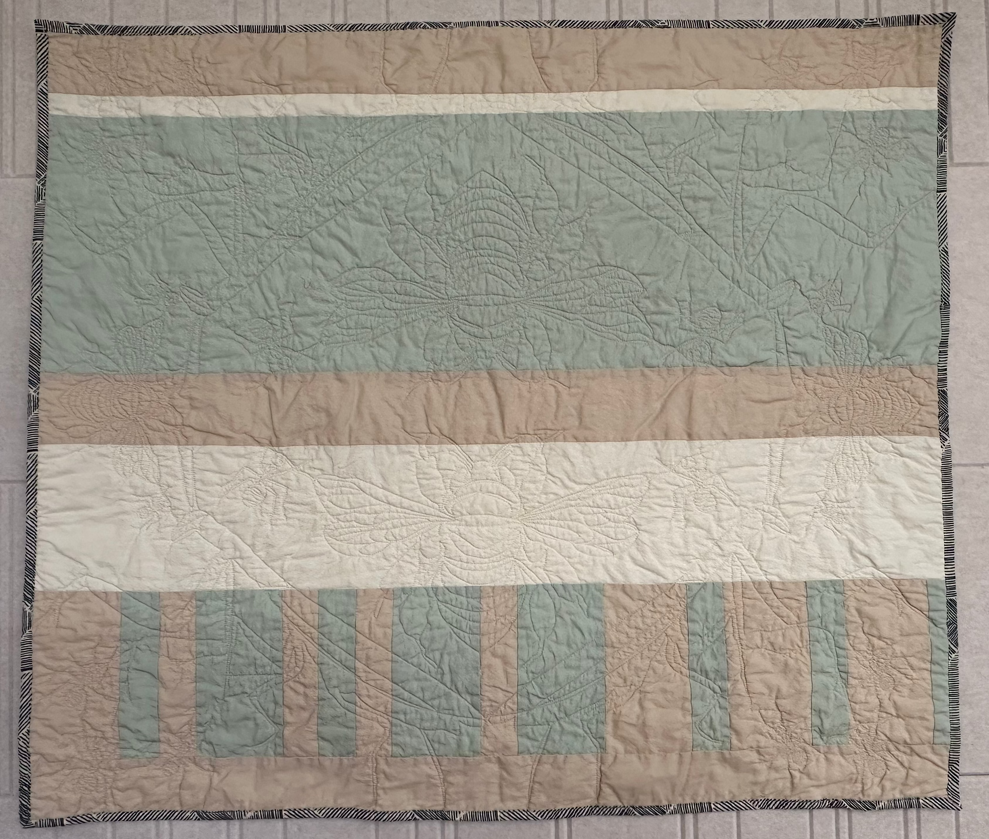 Striped Vera Baby Quilt with Garden Bug Stitches