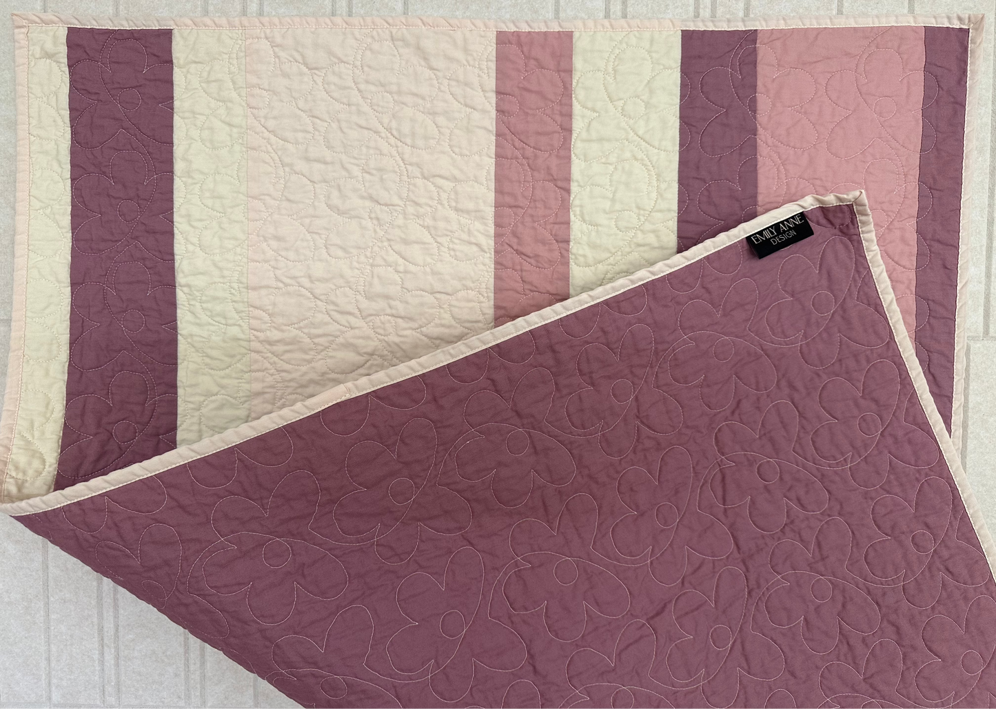 Pink Striped Quilt with Floral Stitching